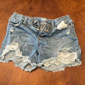 Jean shorts from old navy. Adjustable straps. Light blue with four buttons.